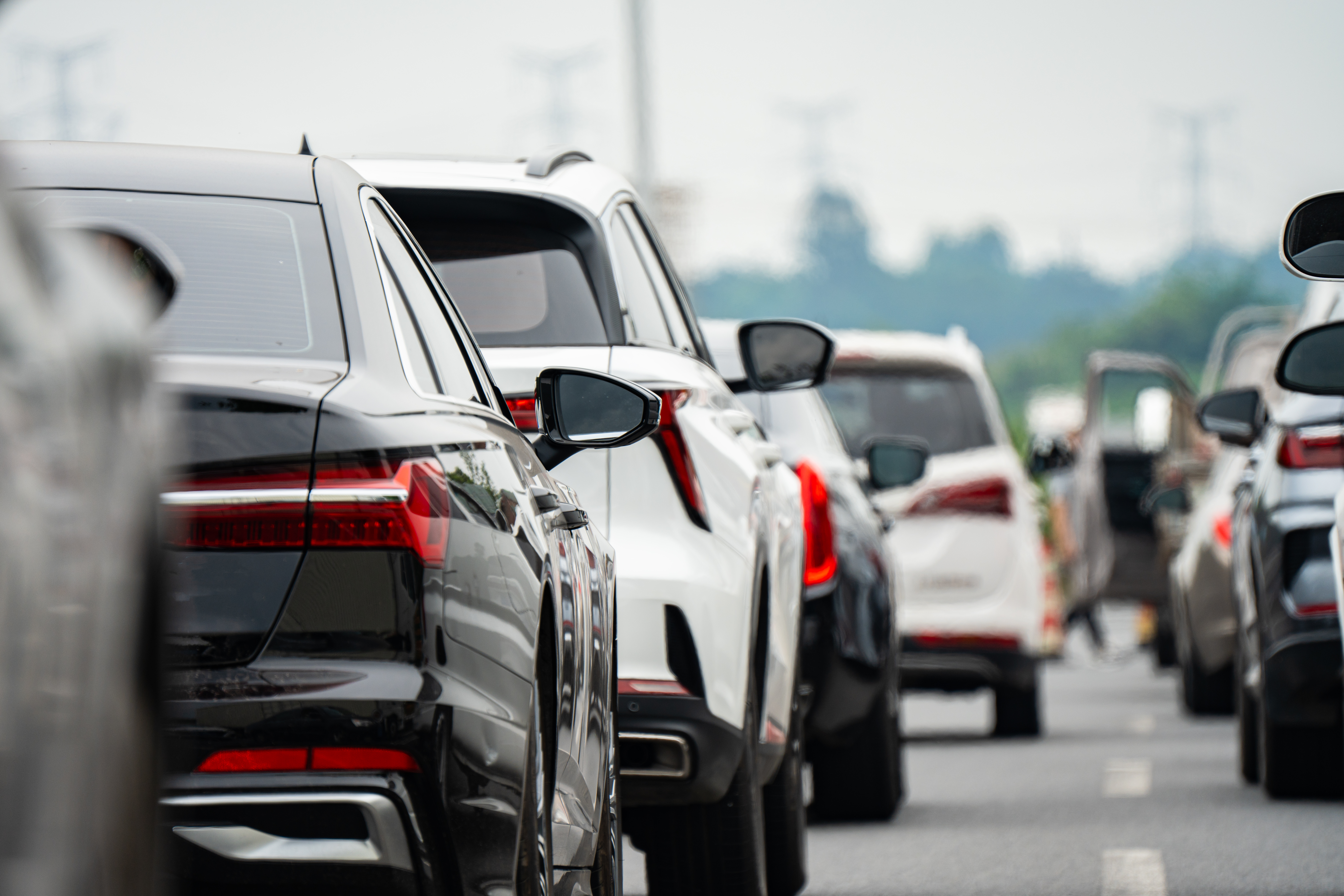 Traffic congestion with multiple cars lined up on a busy roadway
