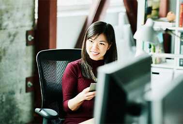 Woman sitting while smiling